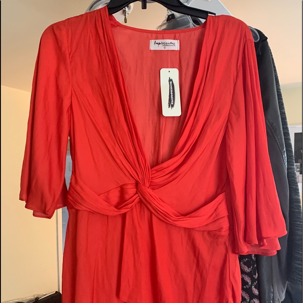 Never worn wrapped red top